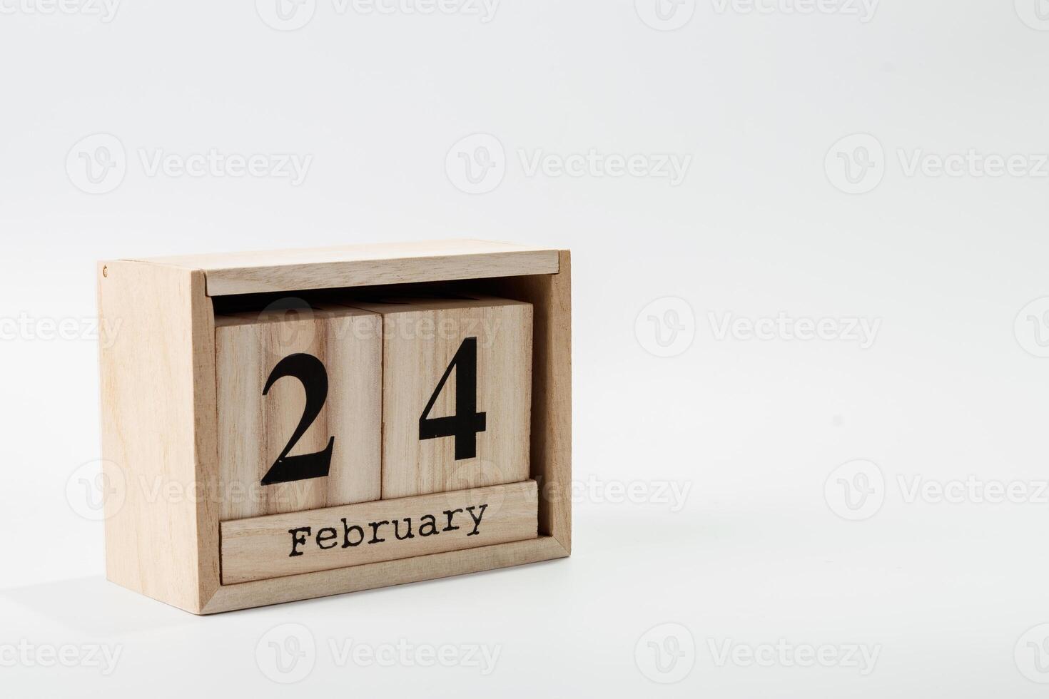 Wooden calendar February 24 on a white background photo