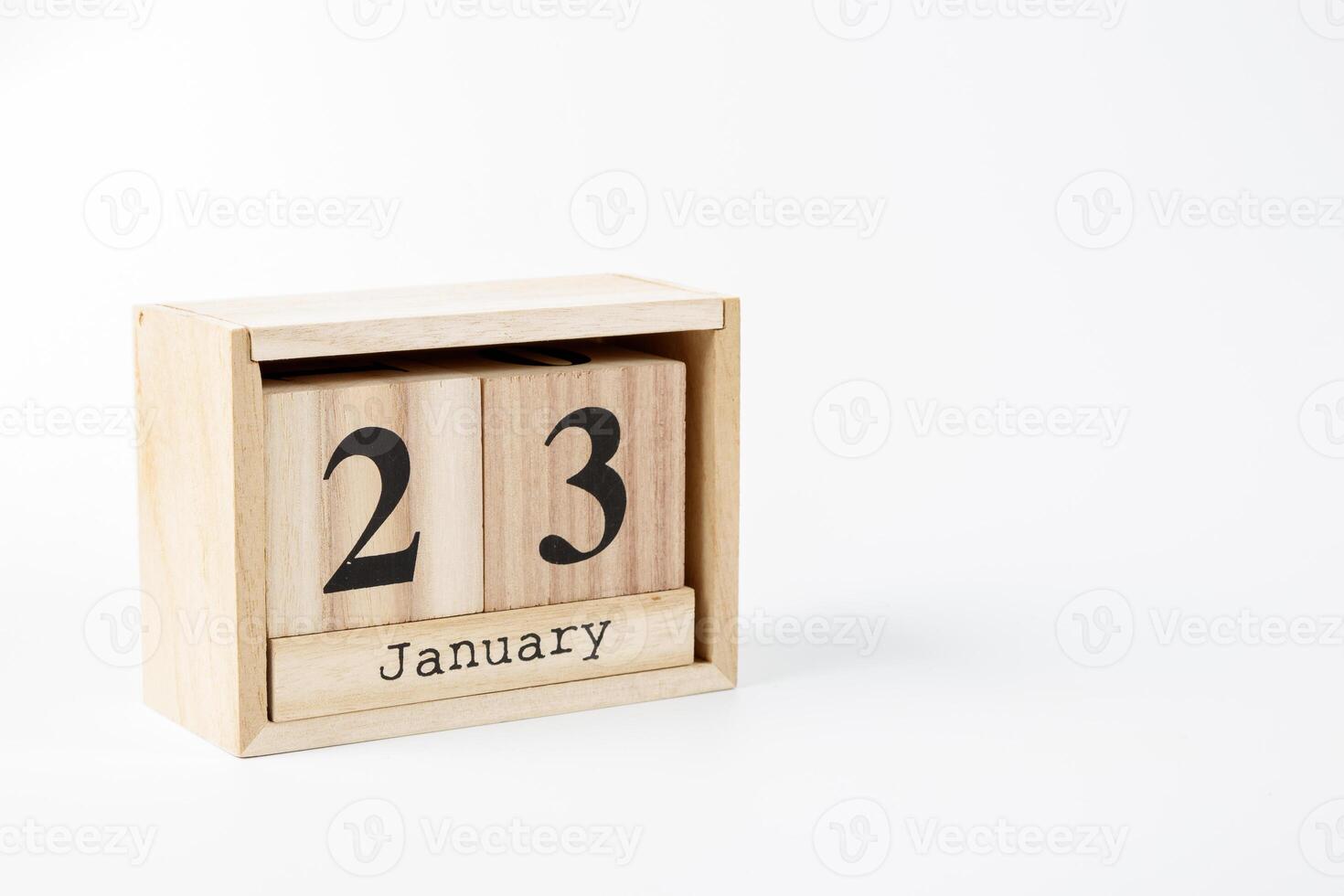 Wooden calendar January 23 on a white background photo