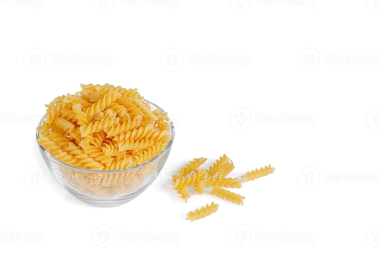 Pasta products in the form of a spiral on a plate, texture, on a white background photo