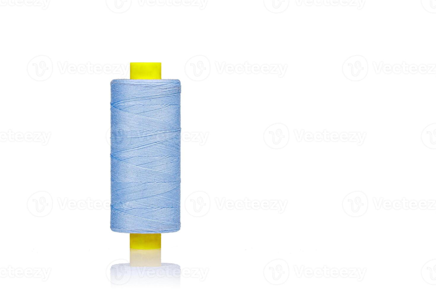 a skein of threads of blue color macro on a white background photo