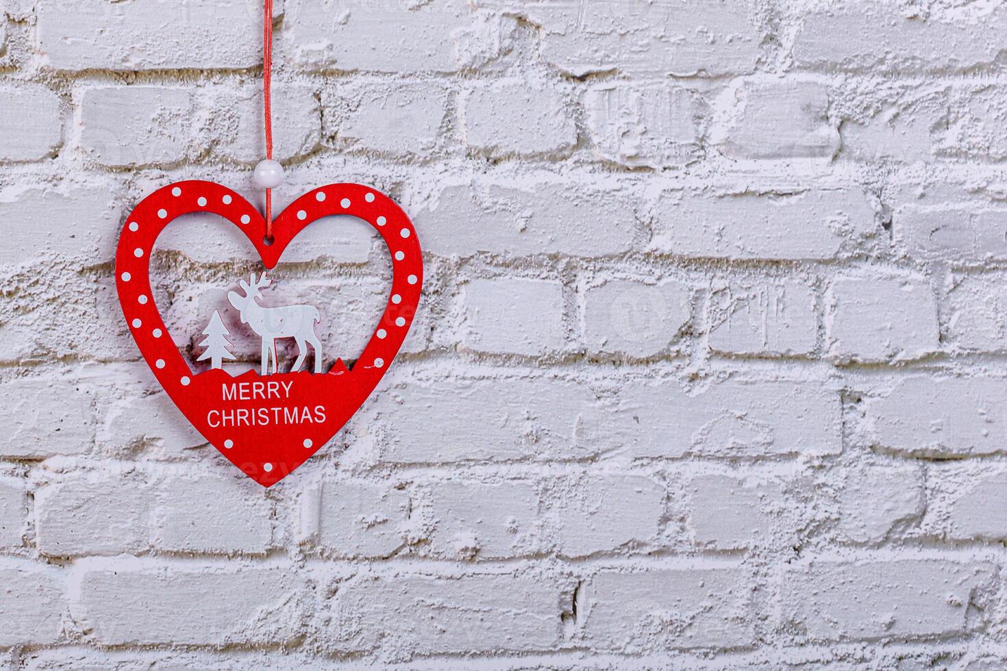 christmas heart on brick wall background photo