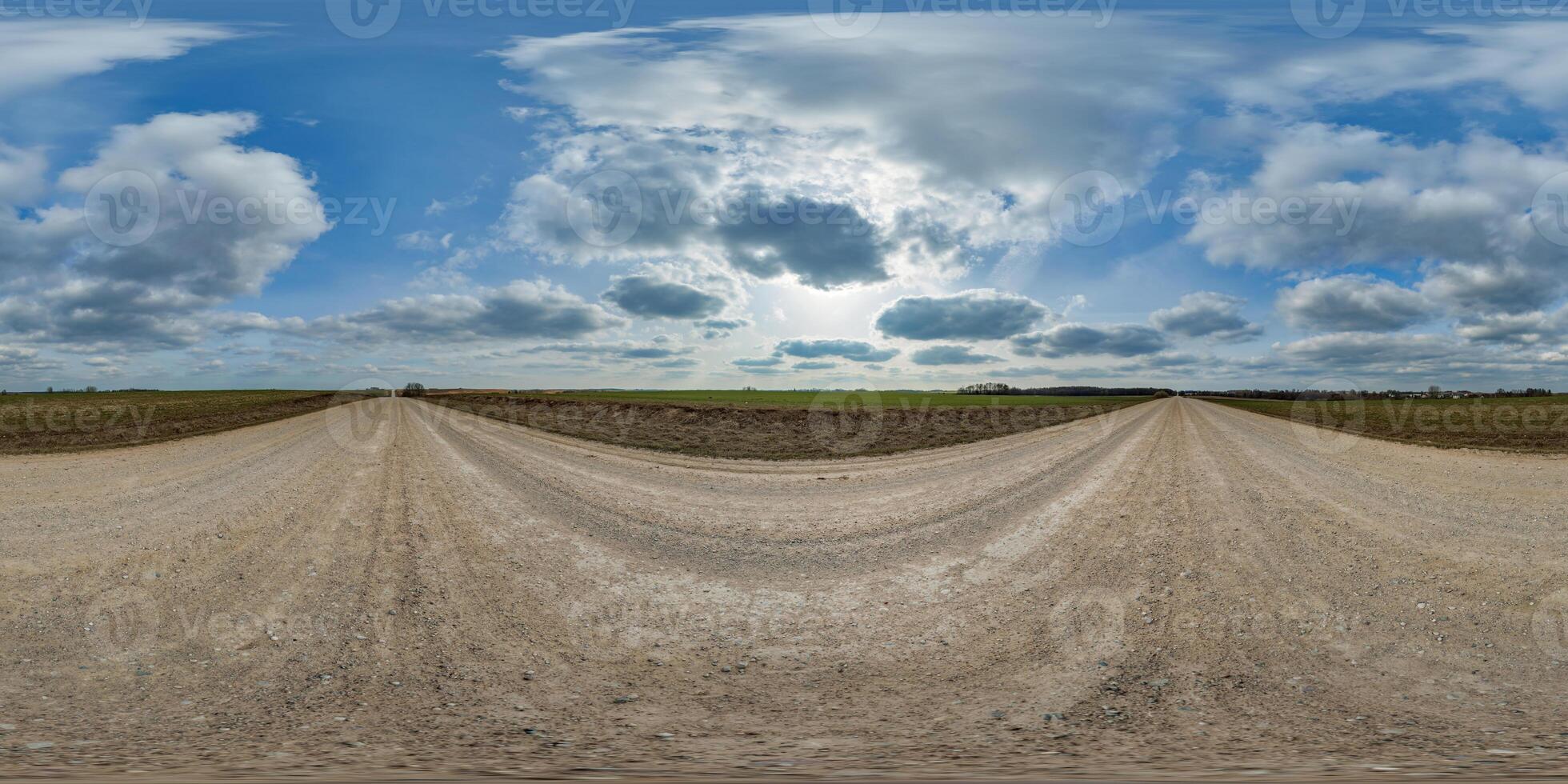 blue sky hdri 360 panorama with awesome clouds on gravel road among fields in spring day in equirectangular full seamless spherical projection, for VR AR content or skydome replacement photo