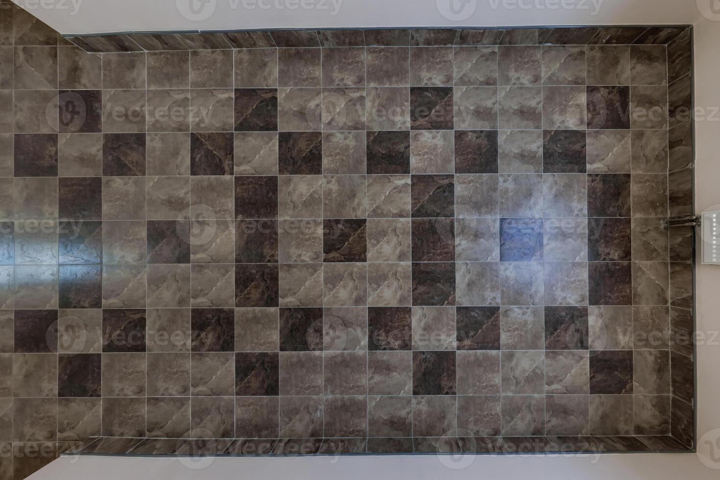 stone and ceramic floor tiles texture in corridor, view from above photo