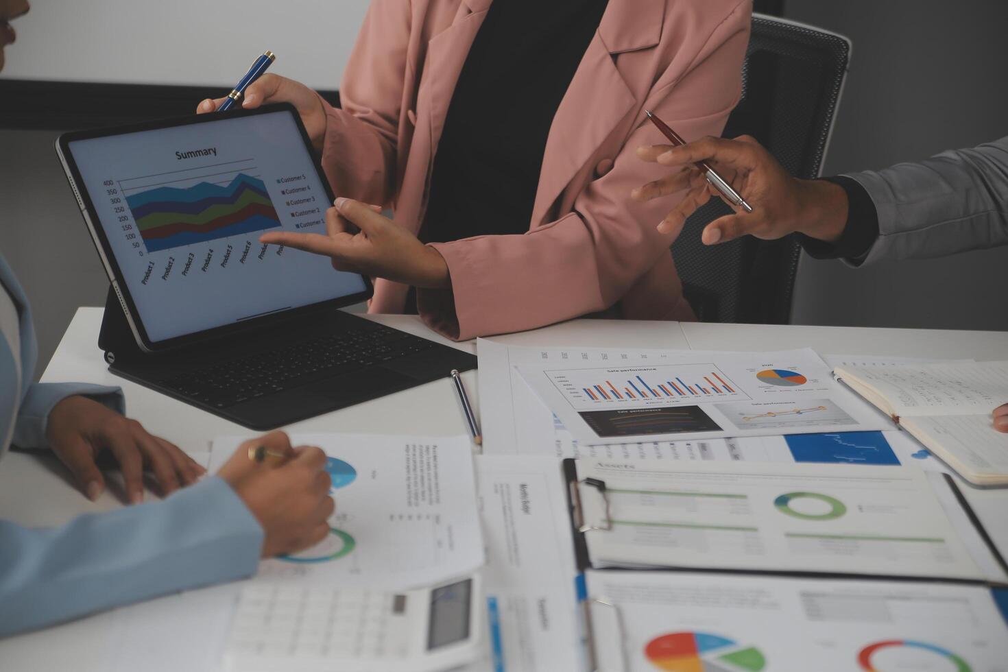Close up of Business team analyzing income charts and graphs with modern laptop computer. Business analysis and strategy concept. photo