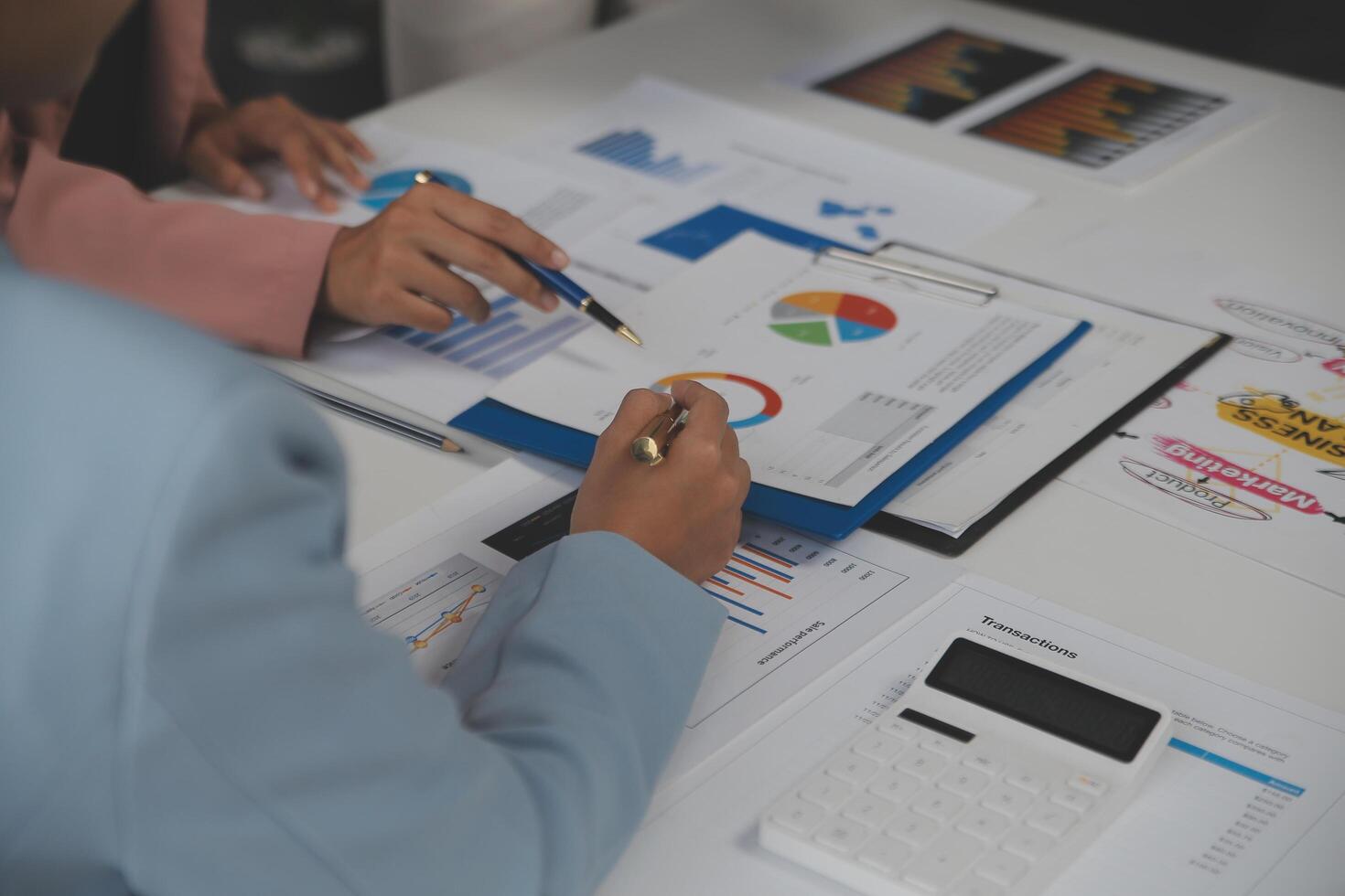 Close up of Business team analyzing income charts and graphs with modern laptop computer. Business analysis and strategy concept. photo