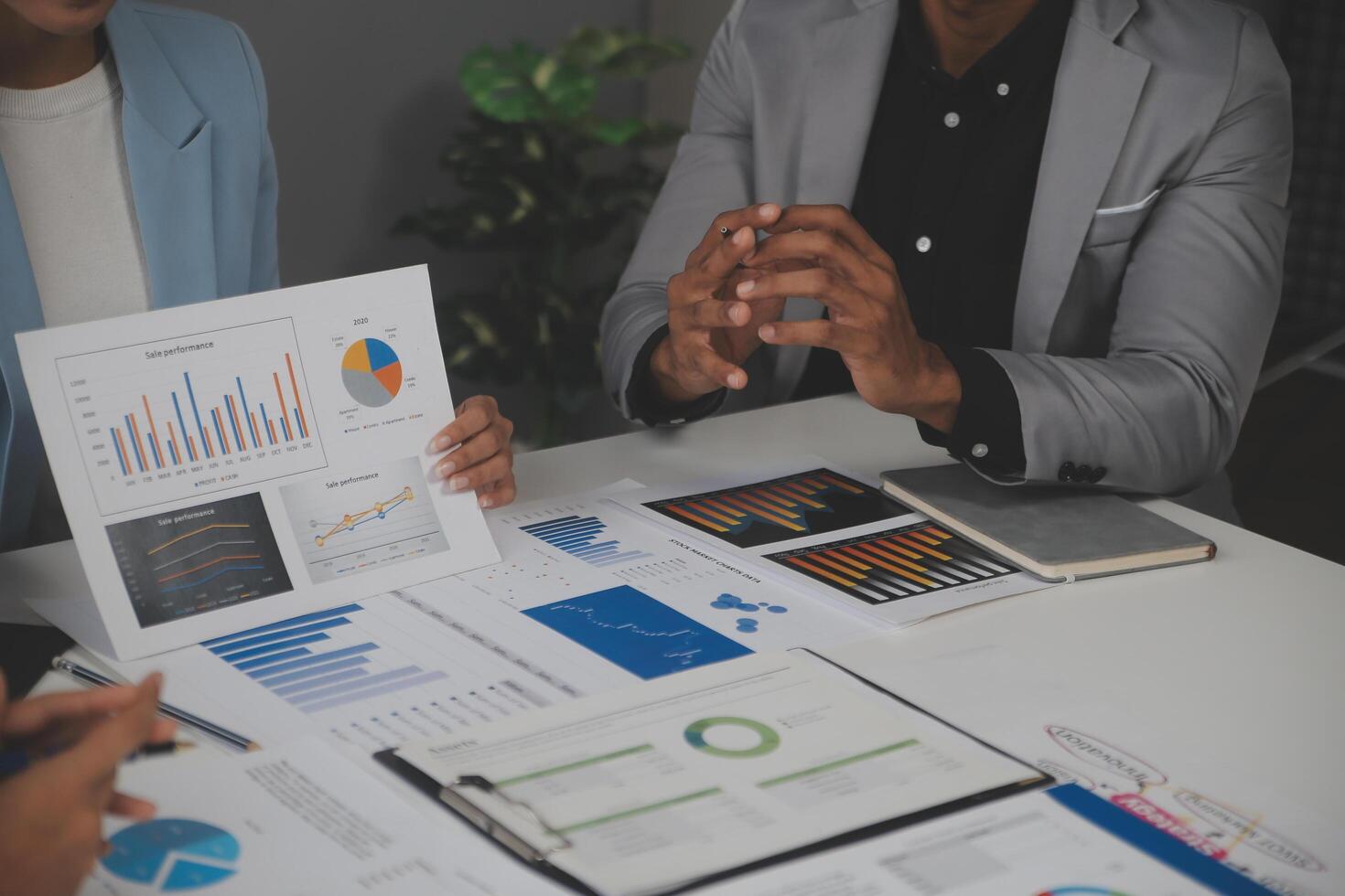 Close up of Business team analyzing income charts and graphs with modern laptop computer. Business analysis and strategy concept. photo