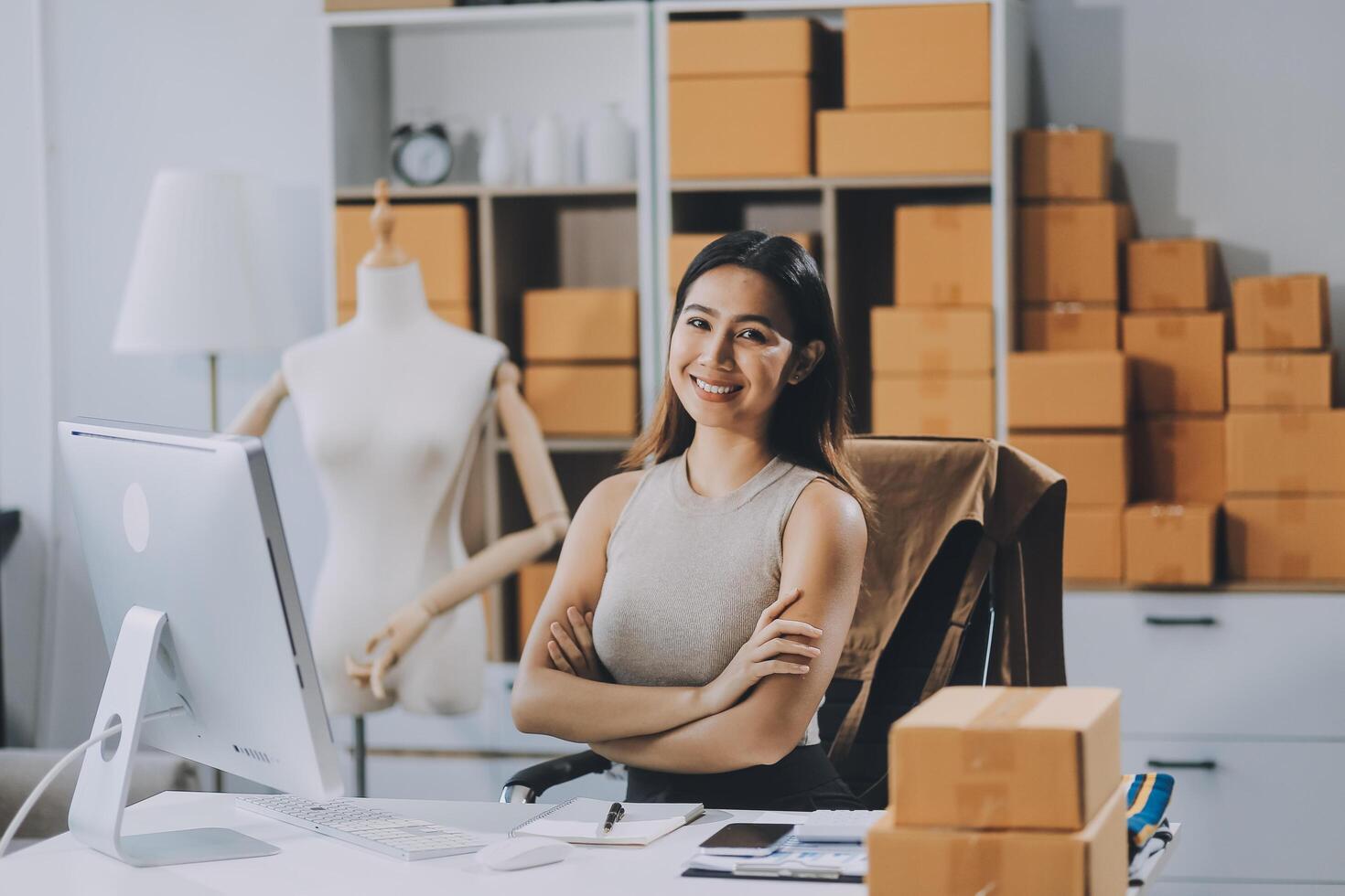 Successful Woman start up online seller at workplace. small business entrepreneur SME or freelance asian woman working with box at home. photo