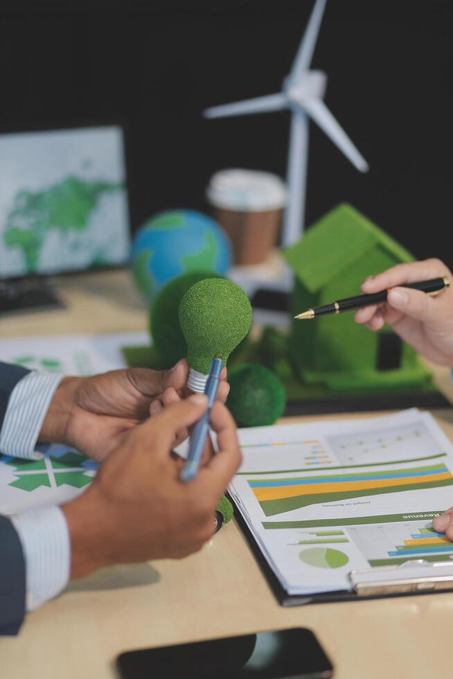 Green energy business company meeting with business people planning and discuss marketing of sustainable and renewable clean energy product with solar cell and wind turbine generator. Trailblazing photo