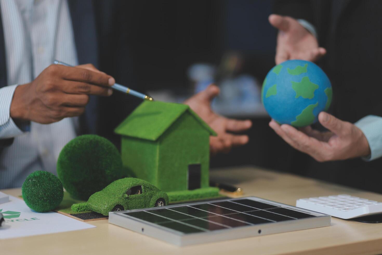 Green energy business company meeting with business people planning and discuss marketing of sustainable and renewable clean energy product with solar cell and wind turbine generator. Trailblazing photo