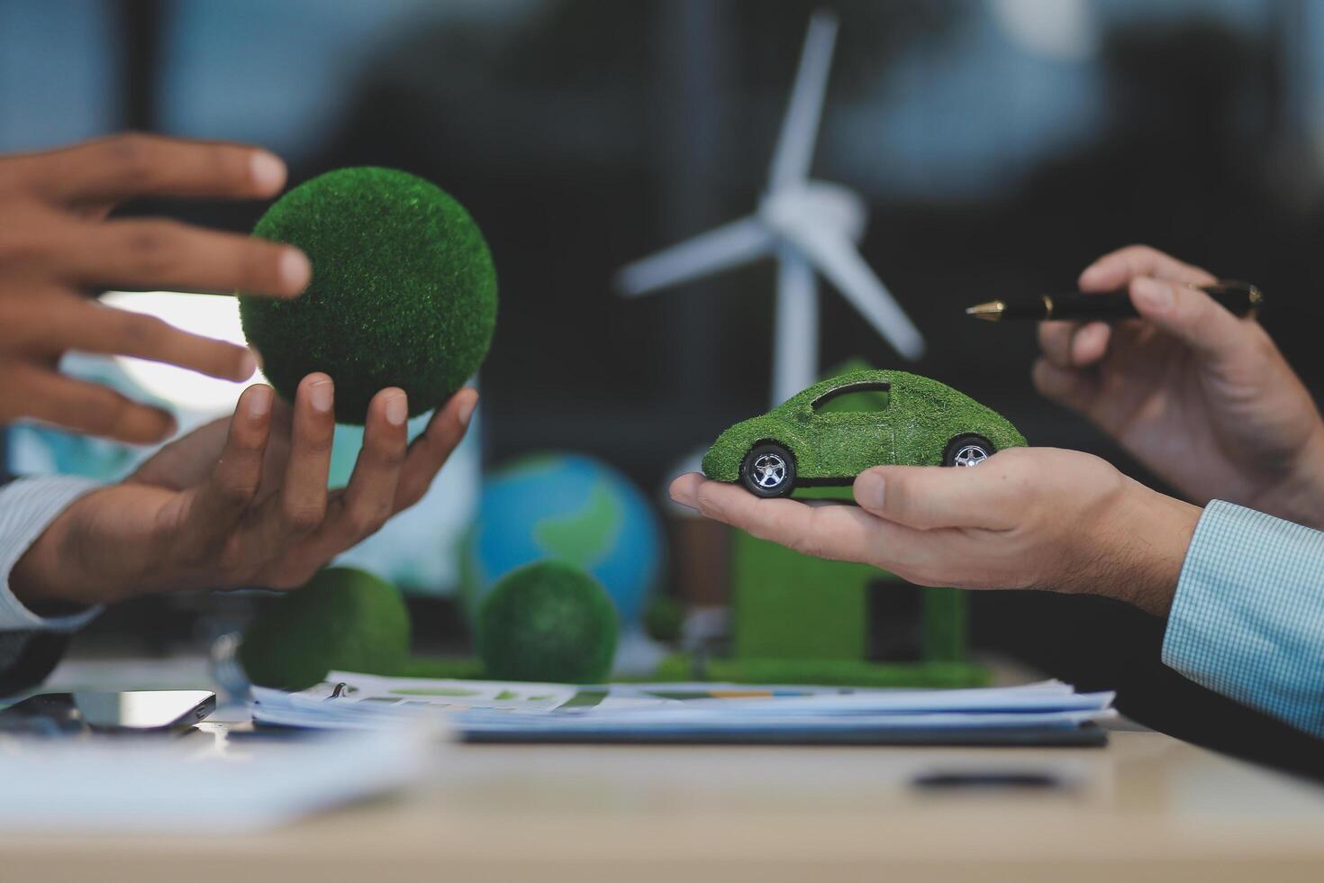 Green energy business company meeting with business people planning and discuss marketing of sustainable and renewable clean energy product with solar cell and wind turbine generator. Trailblazing photo