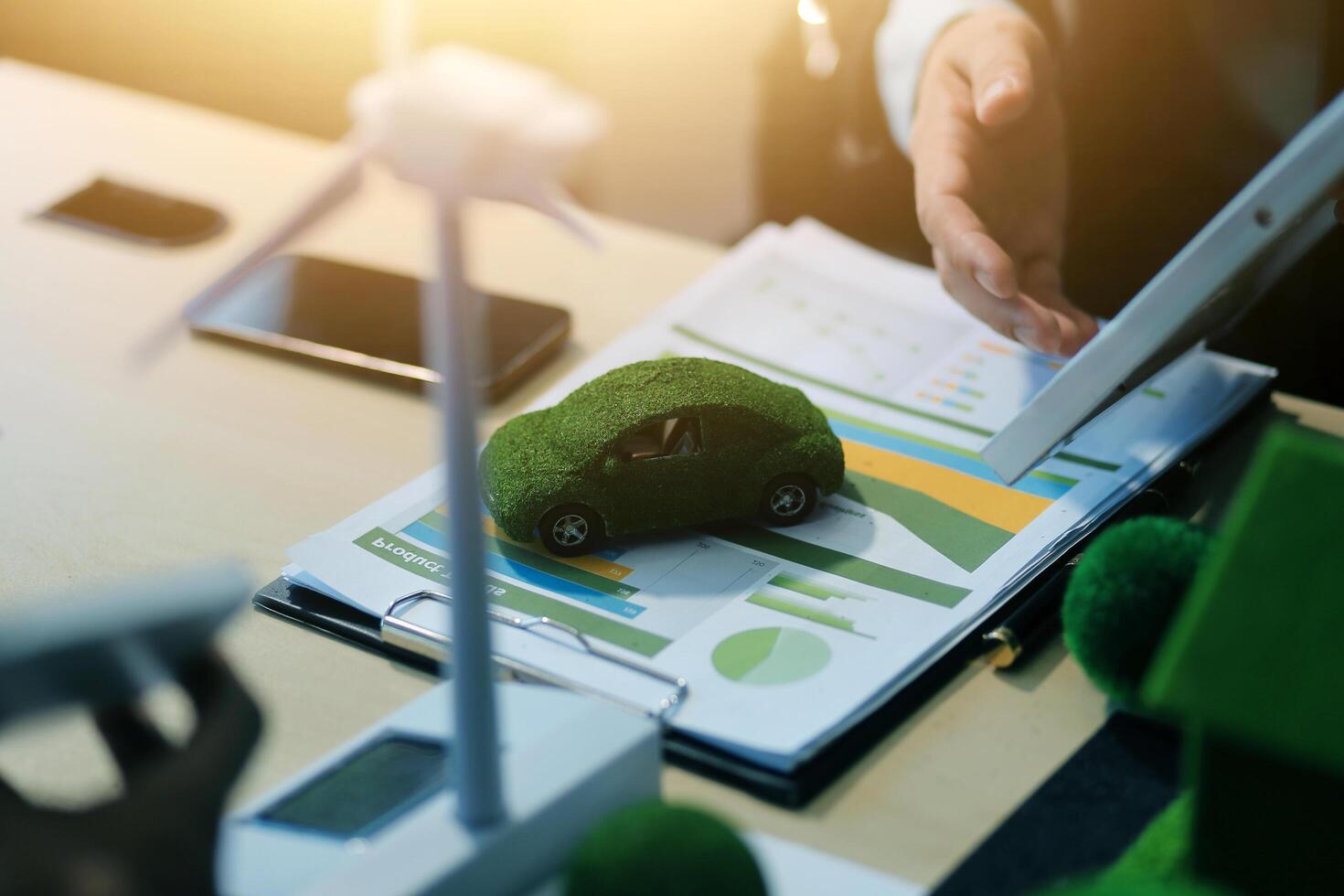 Green energy business company meeting with business people planning and discuss marketing of sustainable and renewable clean energy product with solar cell and wind turbine generator. Trailblazing photo