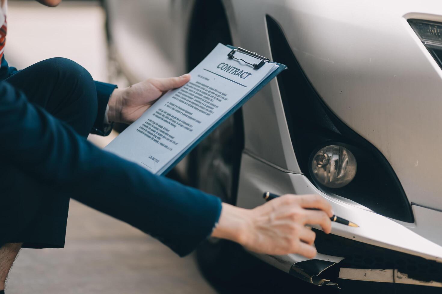A young businesswoman is navigating car insurance options at her desk, considering premiums, deductibles, and coverage while understanding policies and managing claims efficiently. photo