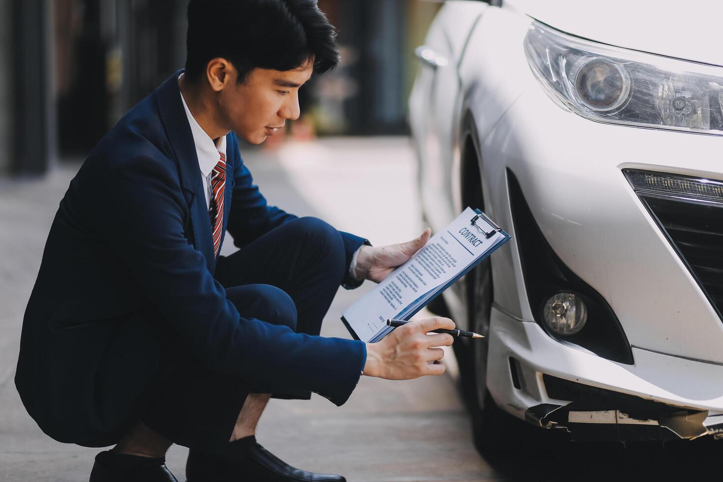 A young businesswoman is navigating car insurance options at her desk, considering premiums, deductibles, and coverage while understanding policies and managing claims efficiently. photo