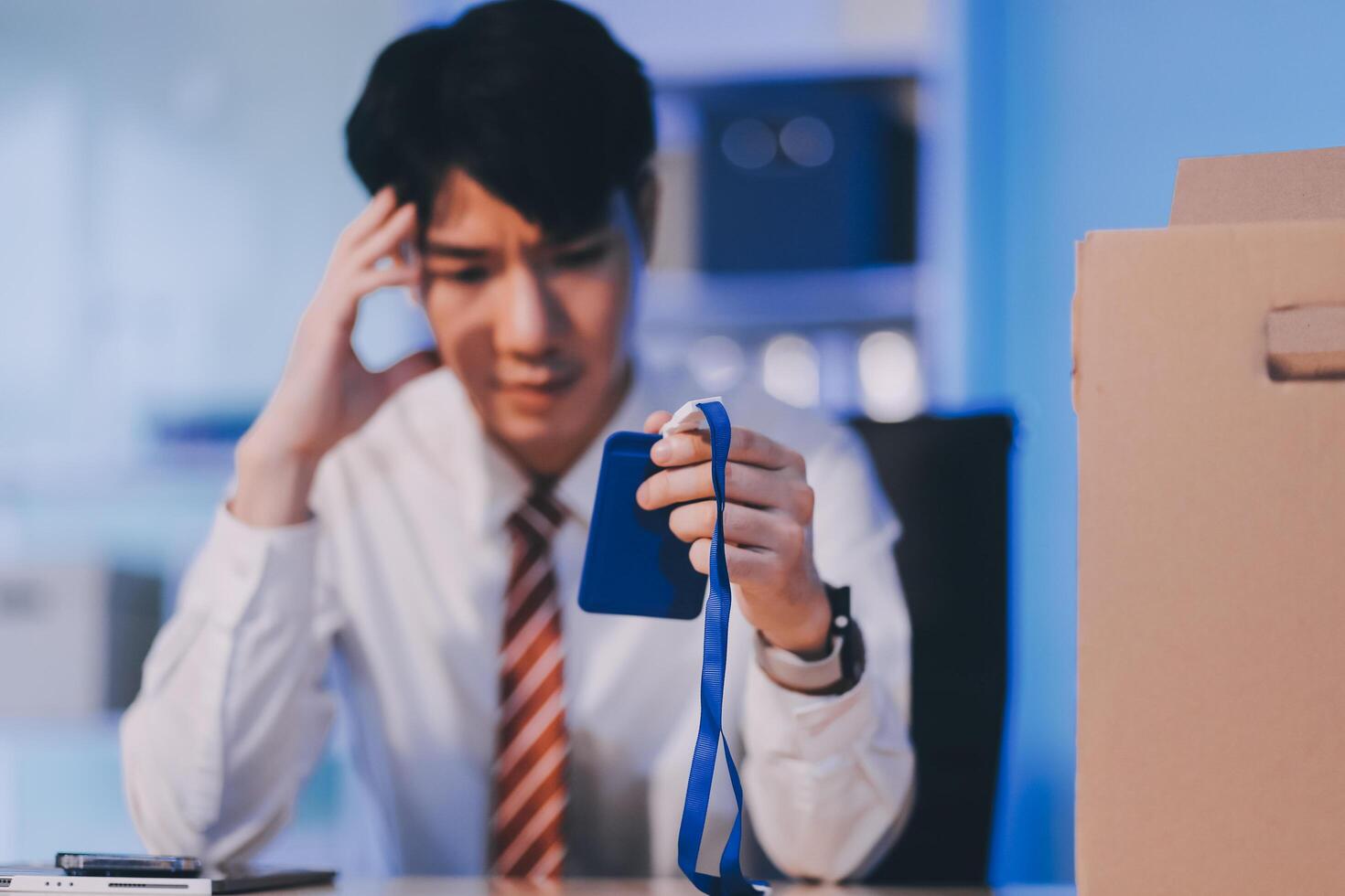 lose job, Your fired. Unhappy business man with surgical medical mask going out with cardboard, looking at camera and feeling looser. indoor shot. business, working and health care concept. photo