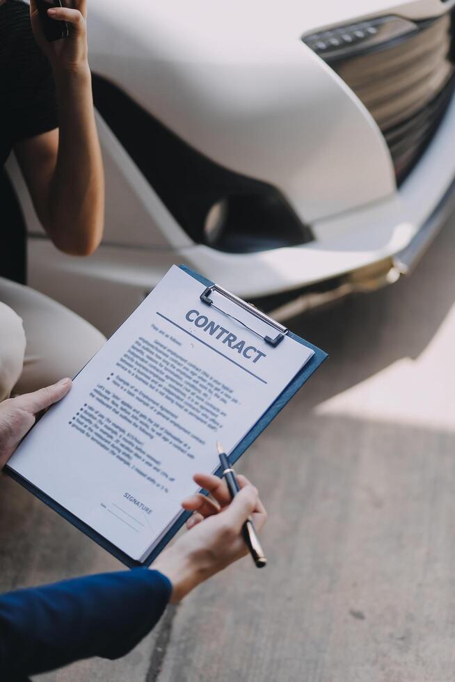 A young businesswoman is navigating car insurance options at her desk, considering premiums, deductibles, and coverage while understanding policies and managing claims efficiently. photo