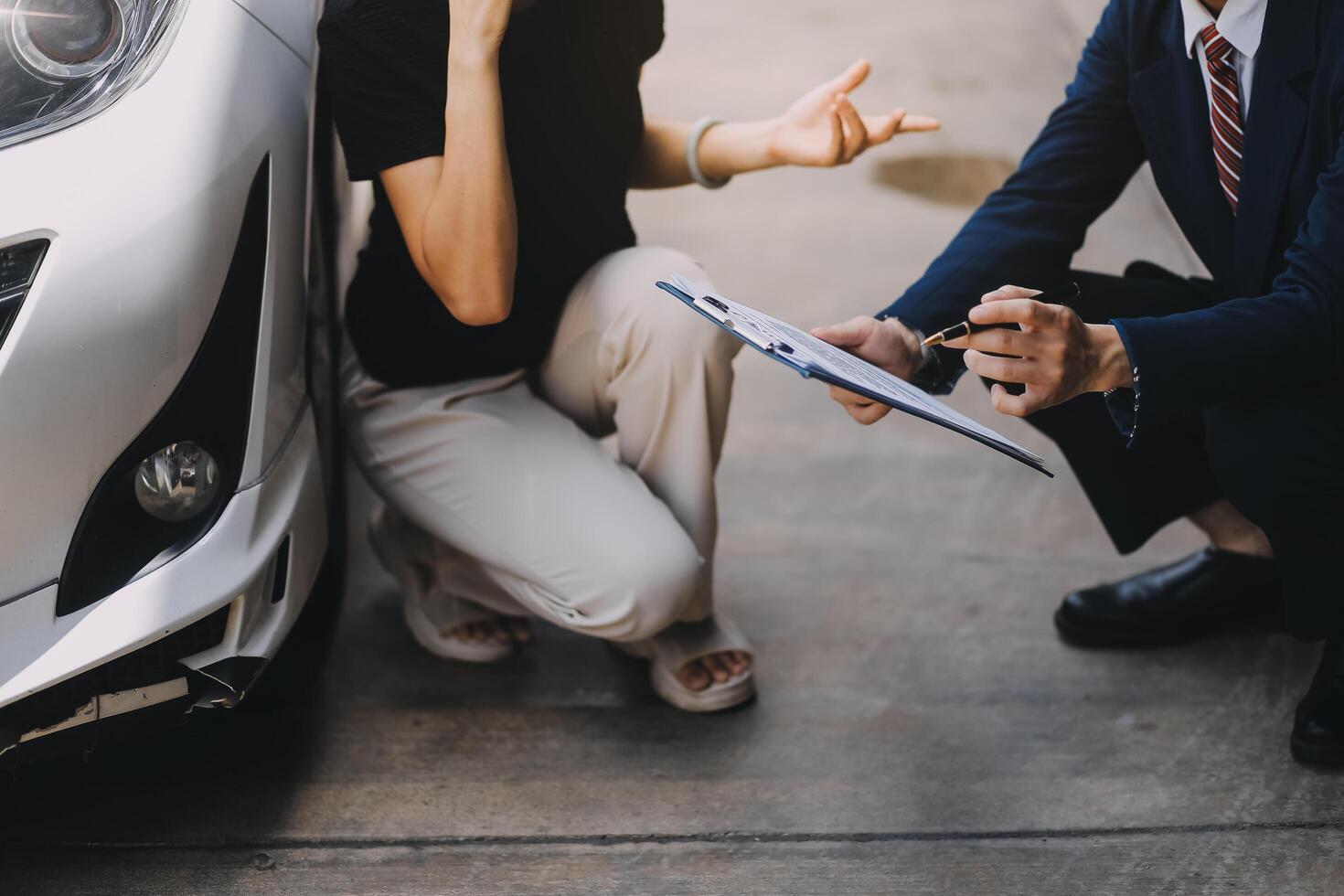 A young businesswoman is navigating car insurance options at her desk, considering premiums, deductibles, and coverage while understanding policies and managing claims efficiently. photo