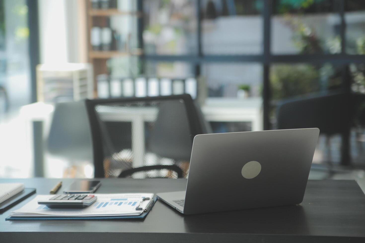 Entrepreneur Asian businessman and businesswoman discussing new business project in tablet in modern Meeting In Modern Office, Asian business casual concept. photo