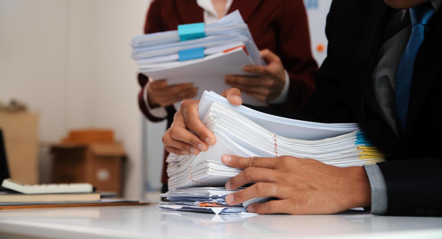 Audit concept,Administrator business man financial inspector and secretary making report calculating balance. Internal Revenue Service checking document. photo