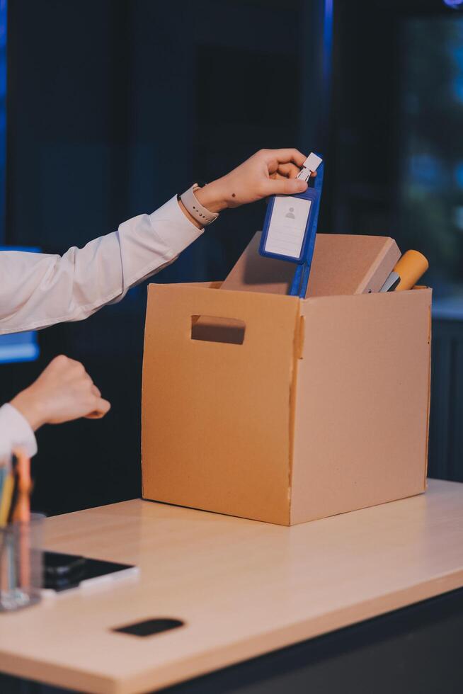 lose job, Your fired. Unhappy business man with surgical medical mask going out with cardboard, looking at camera and feeling looser. indoor shot. business, working and health care concept. photo