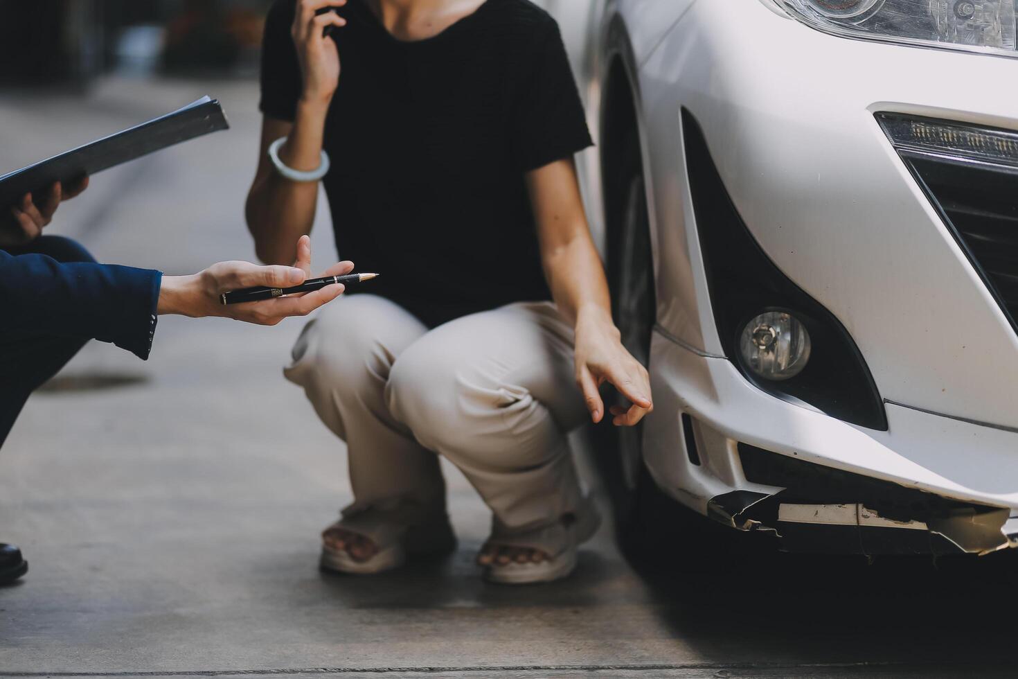 A young businesswoman is navigating car insurance options at her desk, considering premiums, deductibles, and coverage while understanding policies and managing claims efficiently. photo