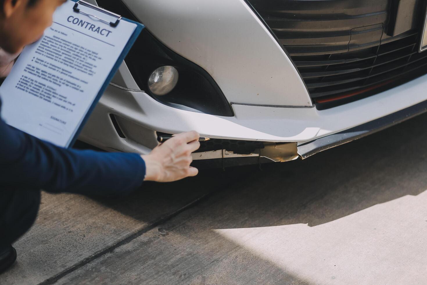 A young businesswoman is navigating car insurance options at her desk, considering premiums, deductibles, and coverage while understanding policies and managing claims efficiently. photo