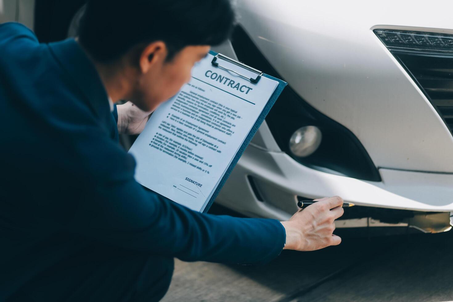 A young businesswoman is navigating car insurance options at her desk, considering premiums, deductibles, and coverage while understanding policies and managing claims efficiently. photo