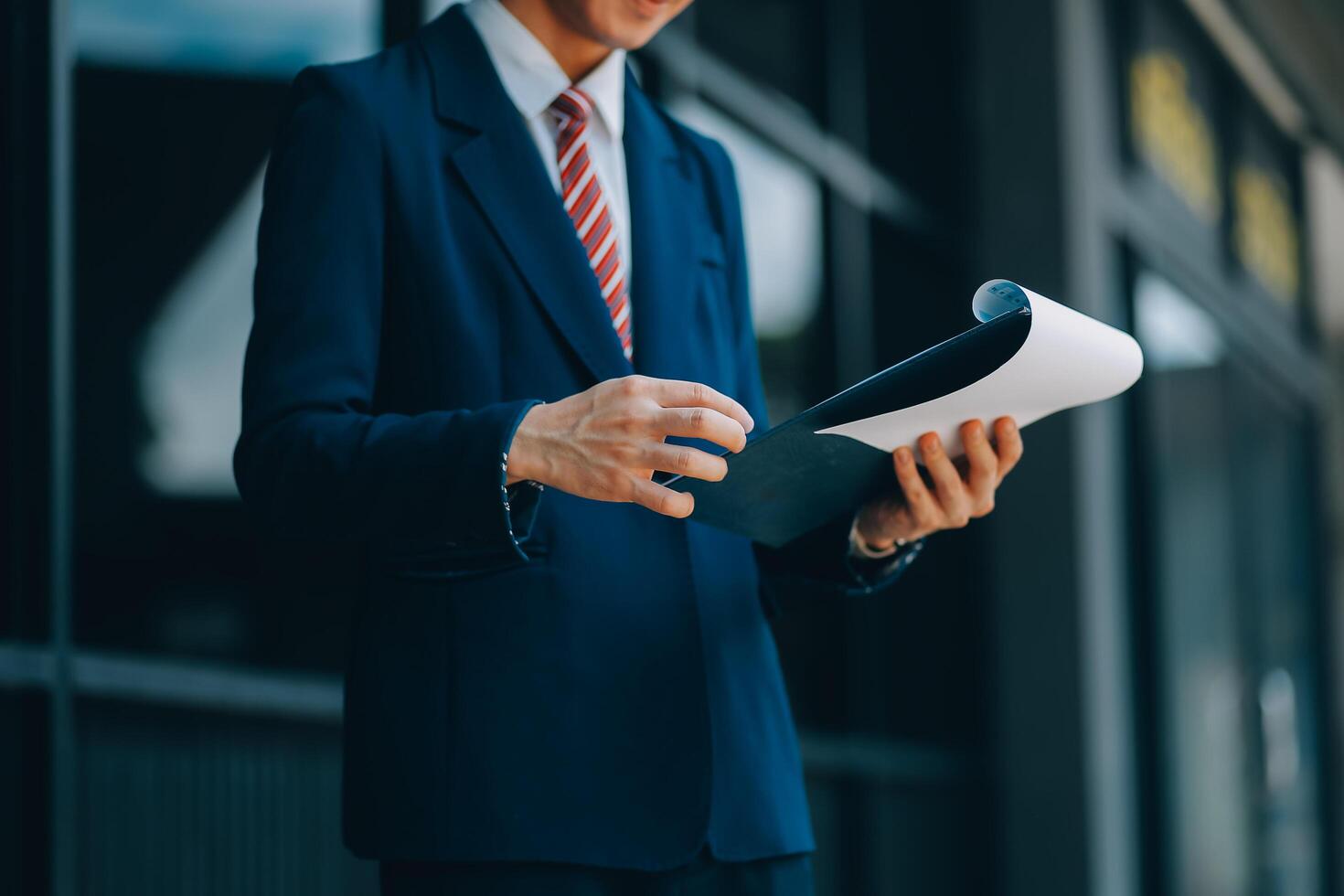 Businessman using tablet and enjoying in coffee break in front of the the corporation. Business, lifestyle concept photo