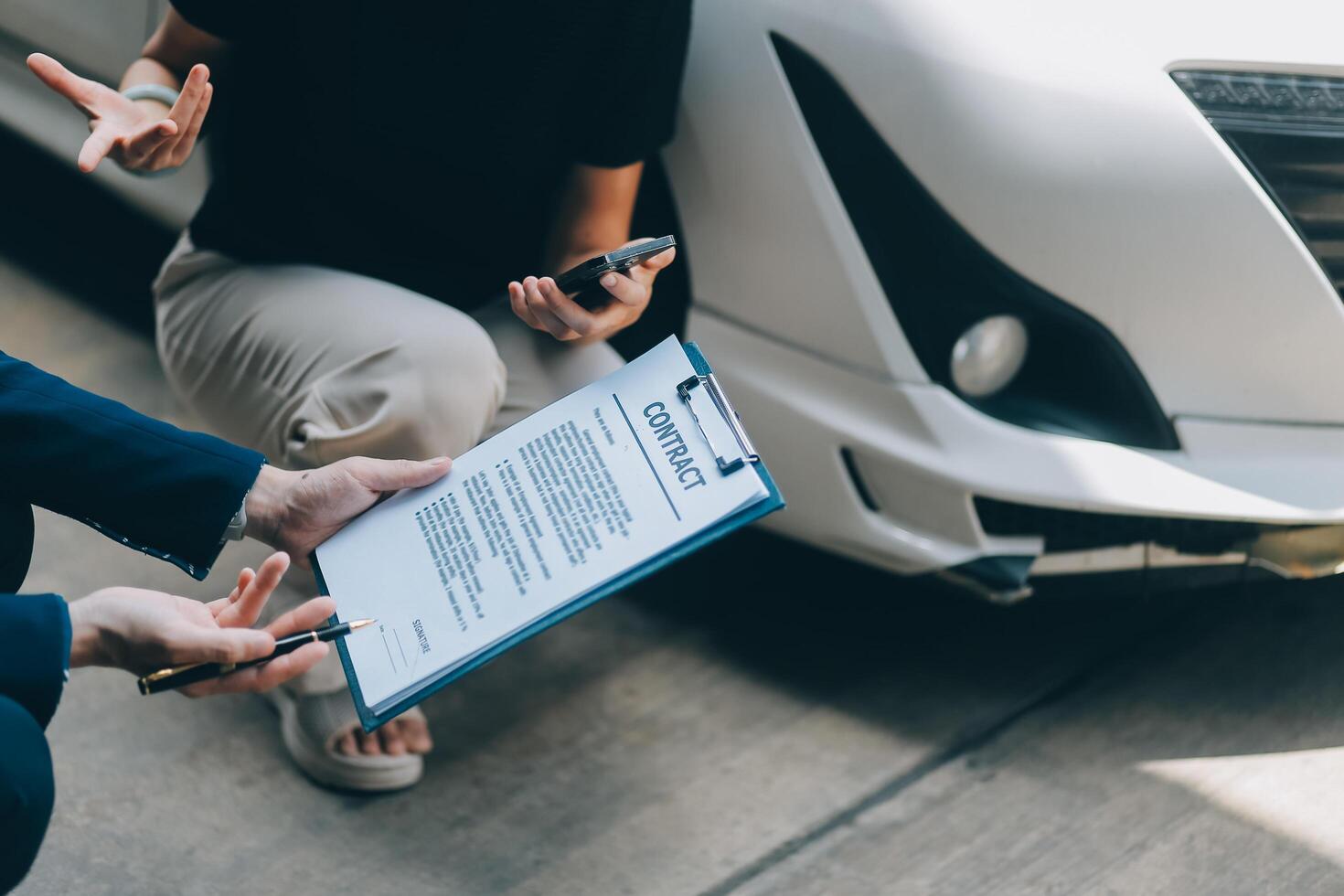 A young businesswoman is navigating car insurance options at her desk, considering premiums, deductibles, and coverage while understanding policies and managing claims efficiently. photo
