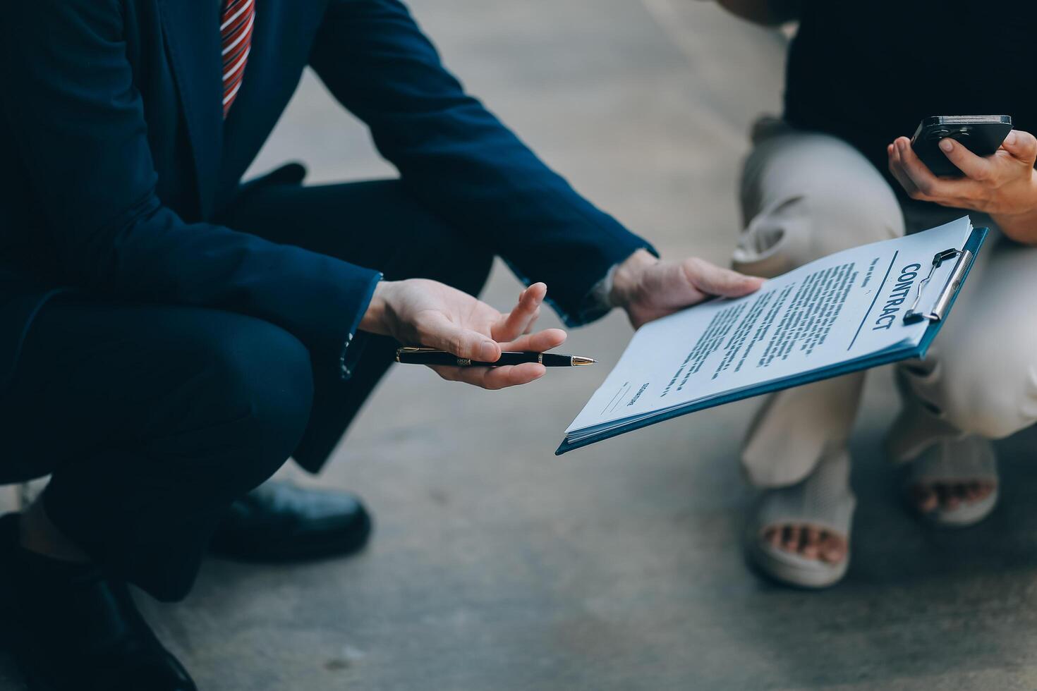 A young businesswoman is navigating car insurance options at her desk, considering premiums, deductibles, and coverage while understanding policies and managing claims efficiently. photo