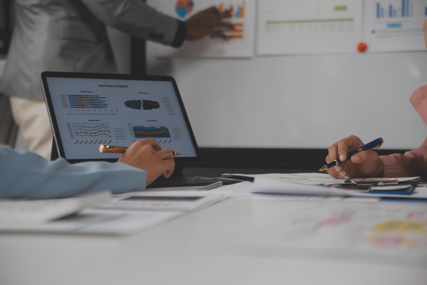 Close up of Business team analyzing income charts and graphs with modern laptop computer. Business analysis and strategy concept. photo