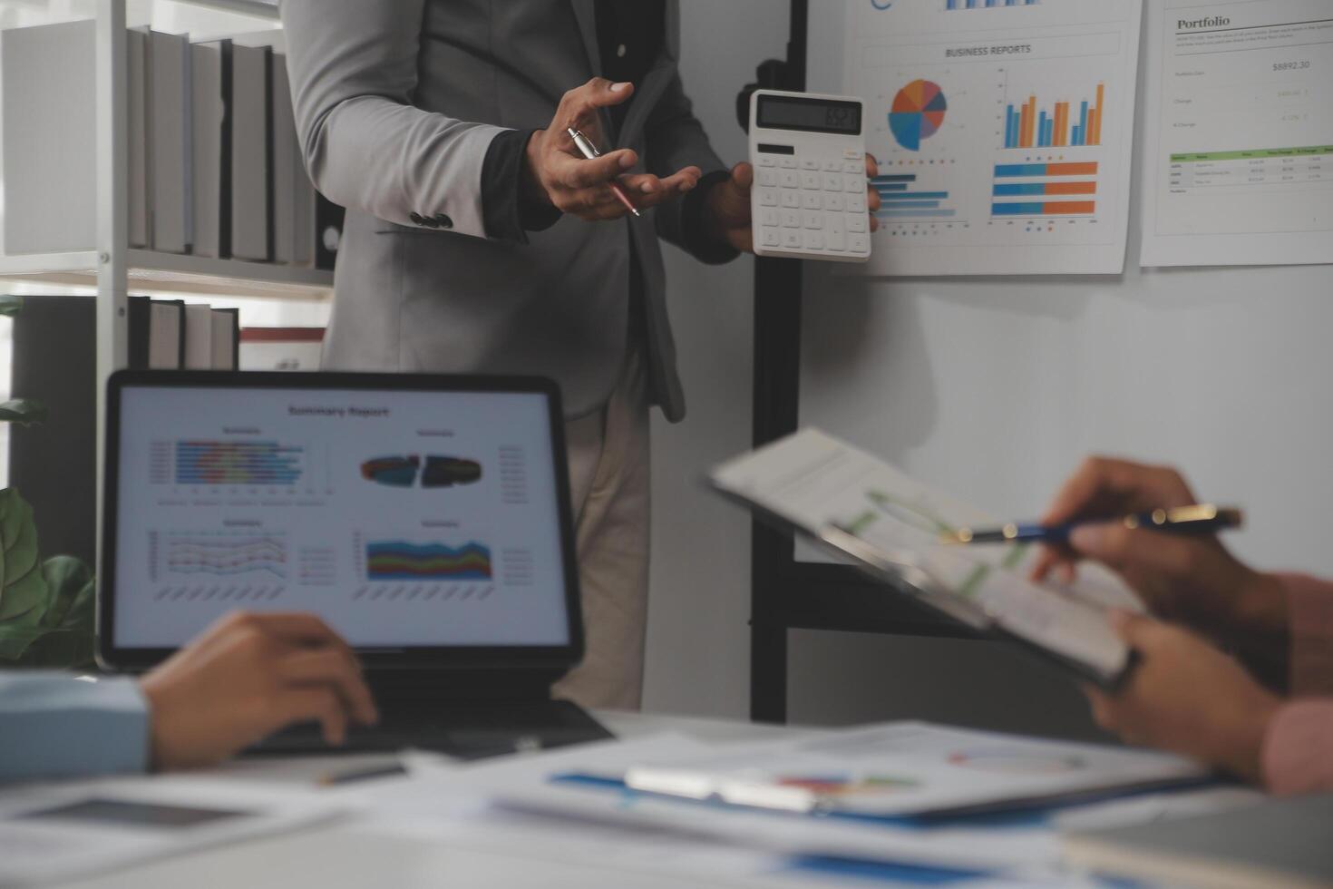 Close up of Business team analyzing income charts and graphs with modern laptop computer. Business analysis and strategy concept. photo