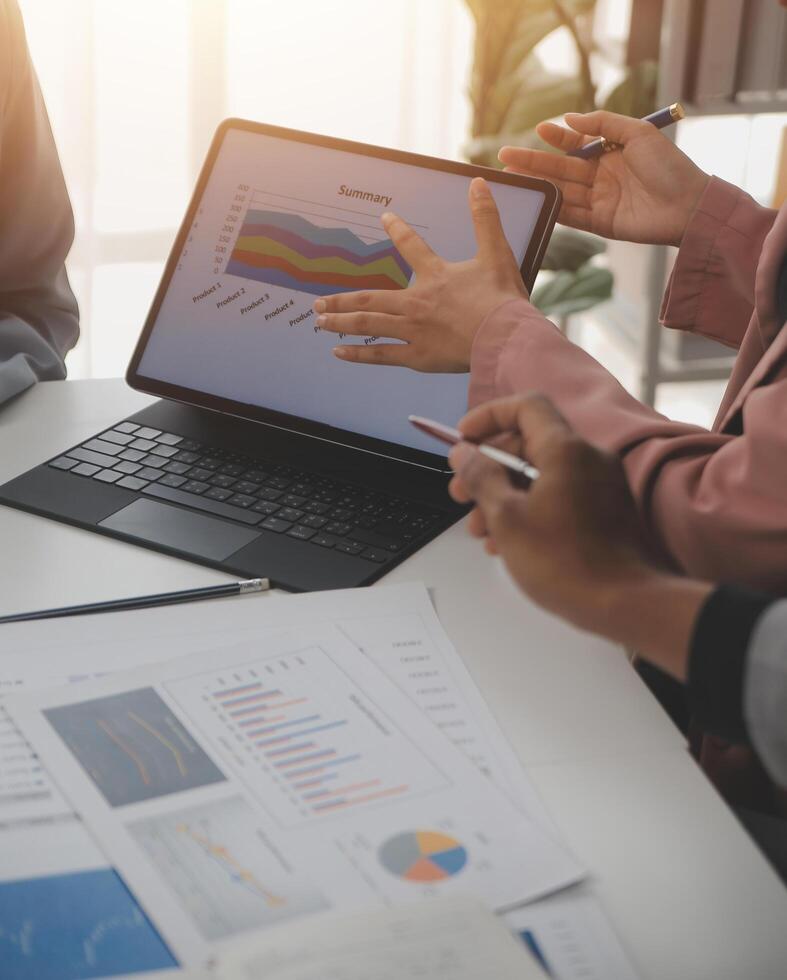 Close up of Business team analyzing income charts and graphs with modern laptop computer. Business analysis and strategy concept. photo