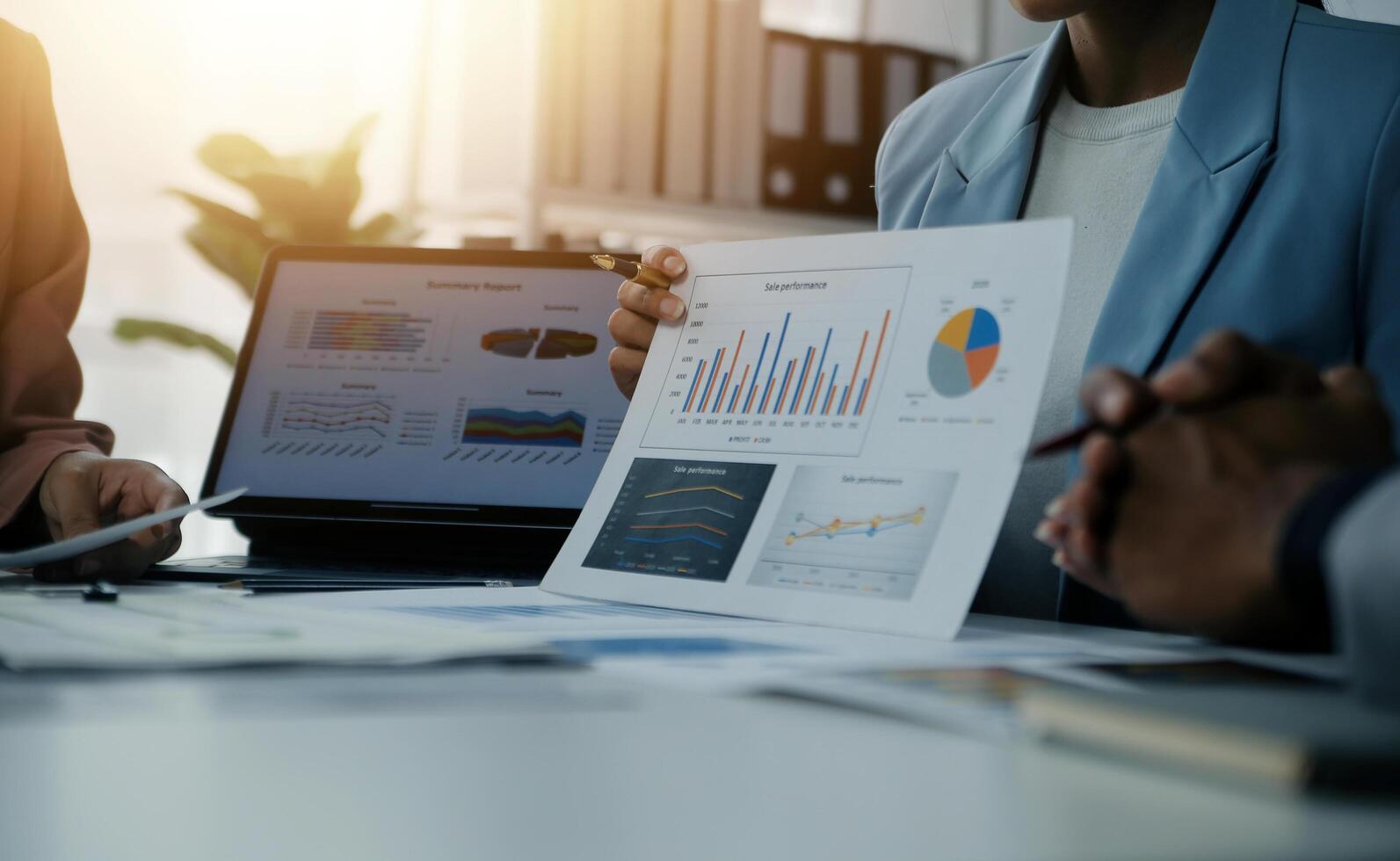 Close up of Business team analyzing income charts and graphs with modern laptop computer. Business analysis and strategy concept. photo