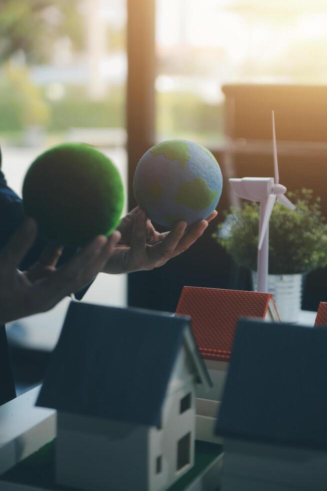 Green energy business company meeting with business people planning and discuss marketing of sustainable and renewable clean energy product with solar cell and wind turbine generator. Trailblazing photo