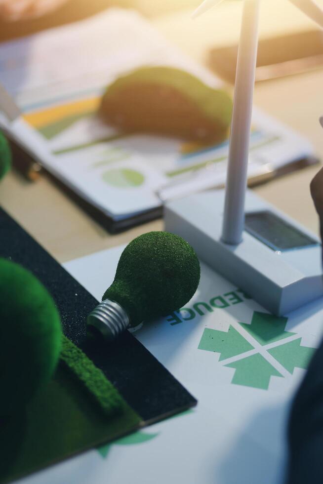 Green energy business company meeting with business people planning and discuss marketing of sustainable and renewable clean energy product with solar cell and wind turbine generator. Trailblazing photo
