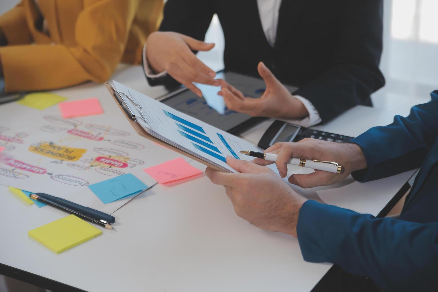 Meeting of business executives discussing analysis of the company's financial situation and business planning with partner collaboration and consultation of strategy. photo