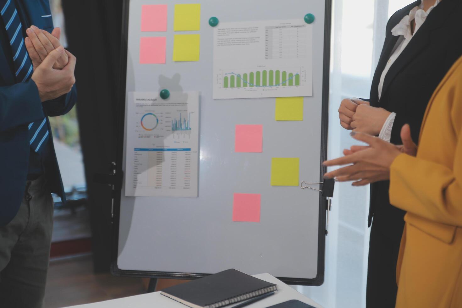 Meeting of business executives discussing analysis of the company's financial situation and business planning with partner collaboration and consultation of strategy. photo