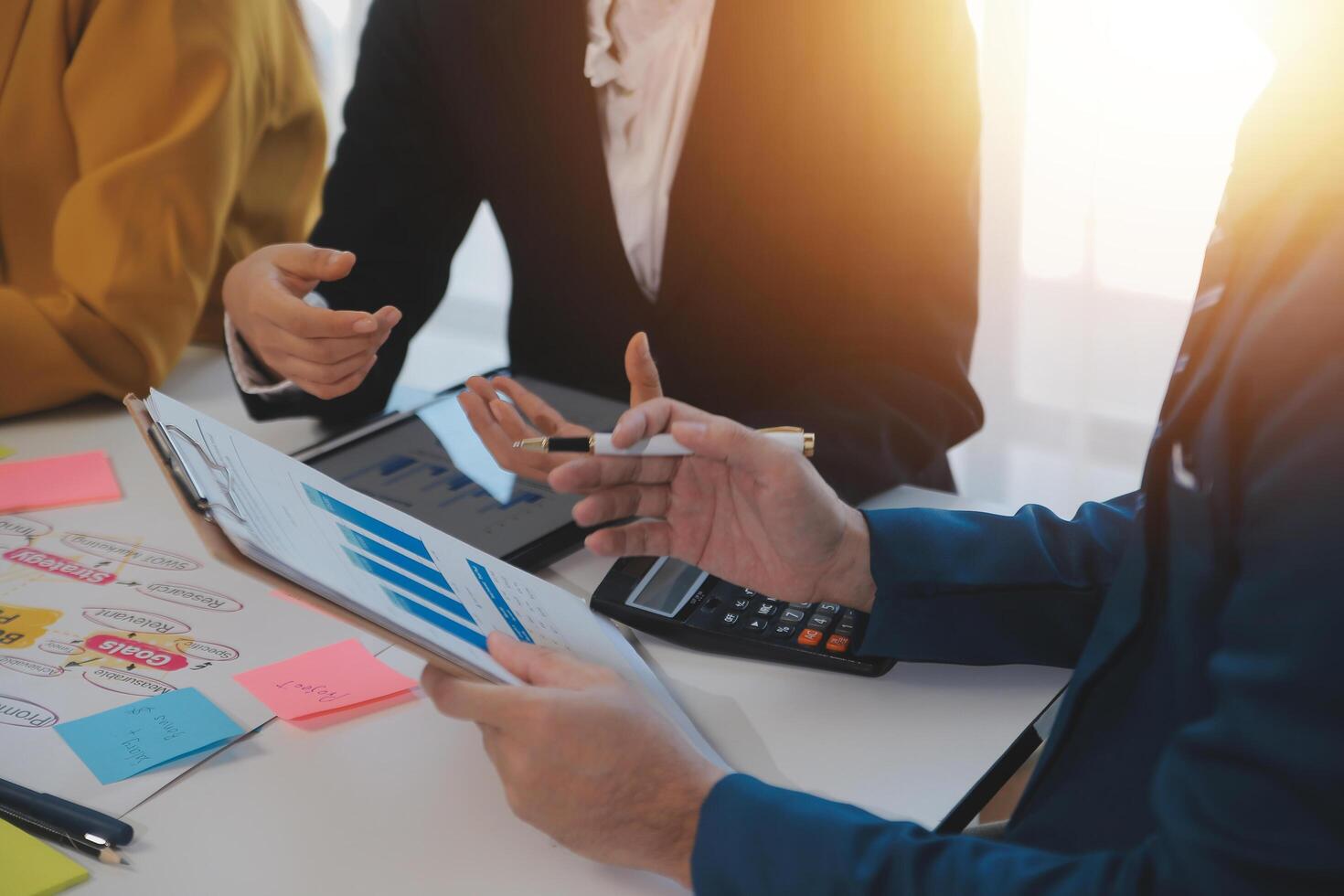 Meeting of business executives discussing analysis of the company's financial situation and business planning with partner collaboration and consultation of strategy. photo