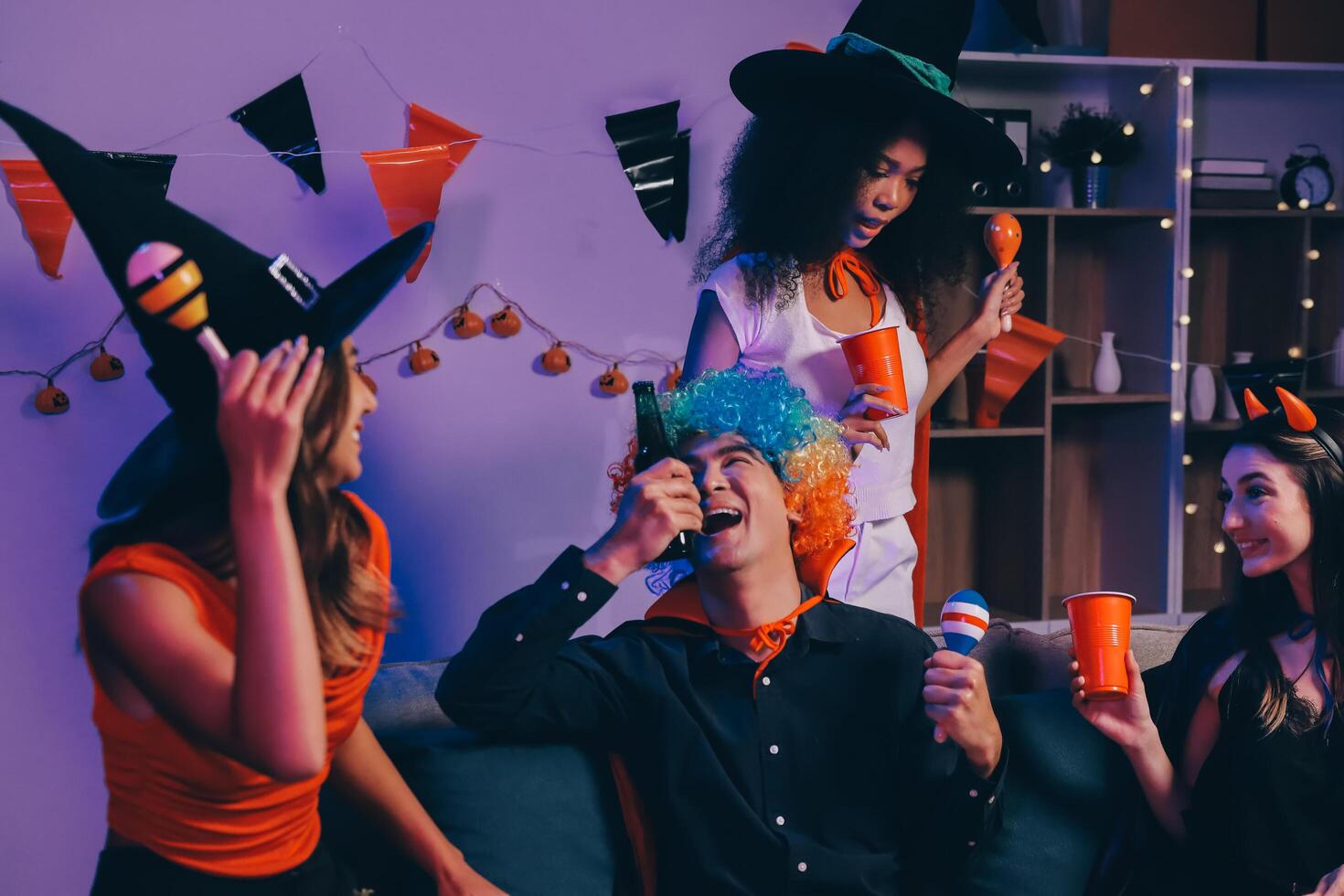 Joyful office Halloween party with coworkers in costumes, celebrating with drinks and laughter, fostering teamwork and festive spirit photo