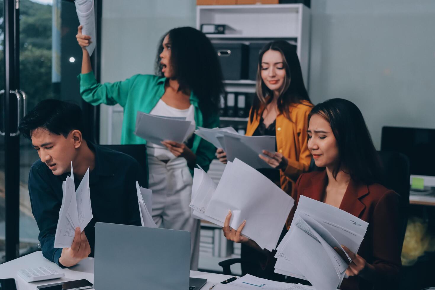 Stress, business people and employee frustrated with multitasking, pressure or overworked by team in chaos with paperwork. Anxiety, headache and worker overwhelmed by group and burnout in crisis photo
