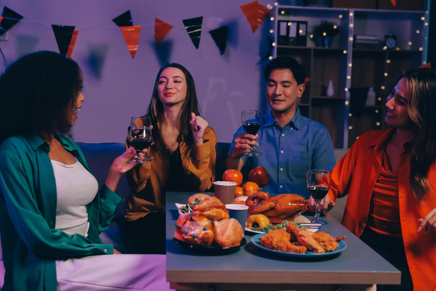Joyful office Halloween party with coworkers in costumes, celebrating with drinks and laughter, fostering teamwork and festive spirit photo