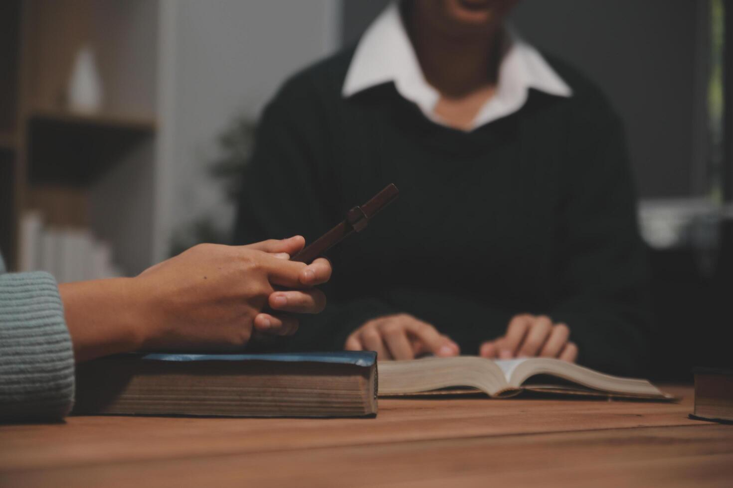 Christian group are praying to god with the bible and sharing the gospel. Concept of faith for god. photo