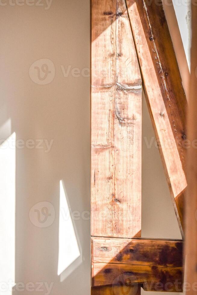 A wooden beam is in the middle of a room photo