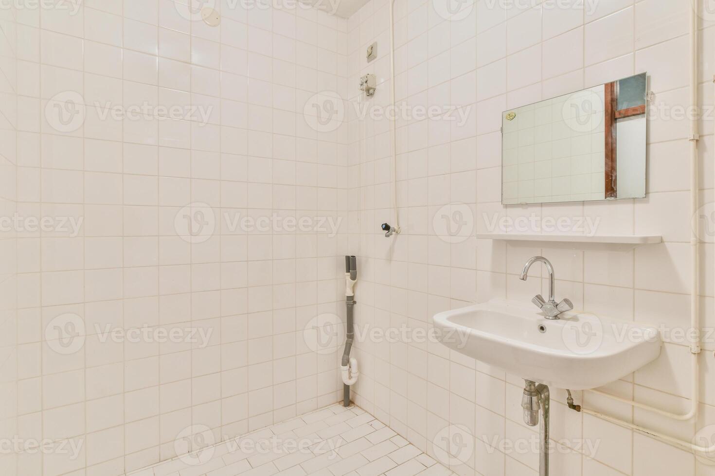 A bathroom with a sink, mirror and toilet photo