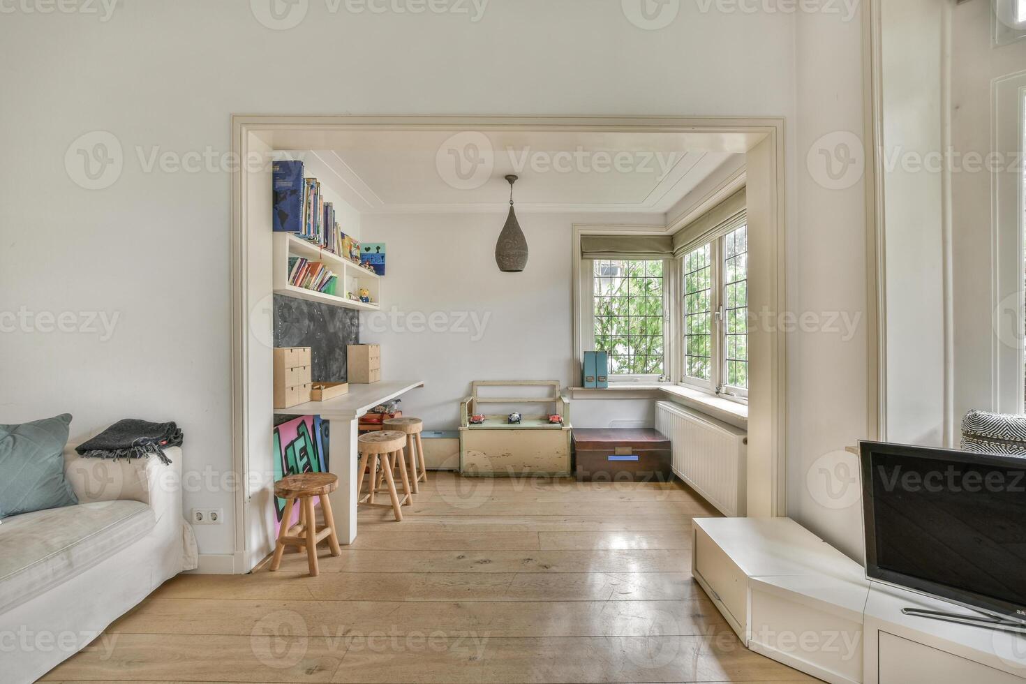 A living room with a couch, a table and a television photo