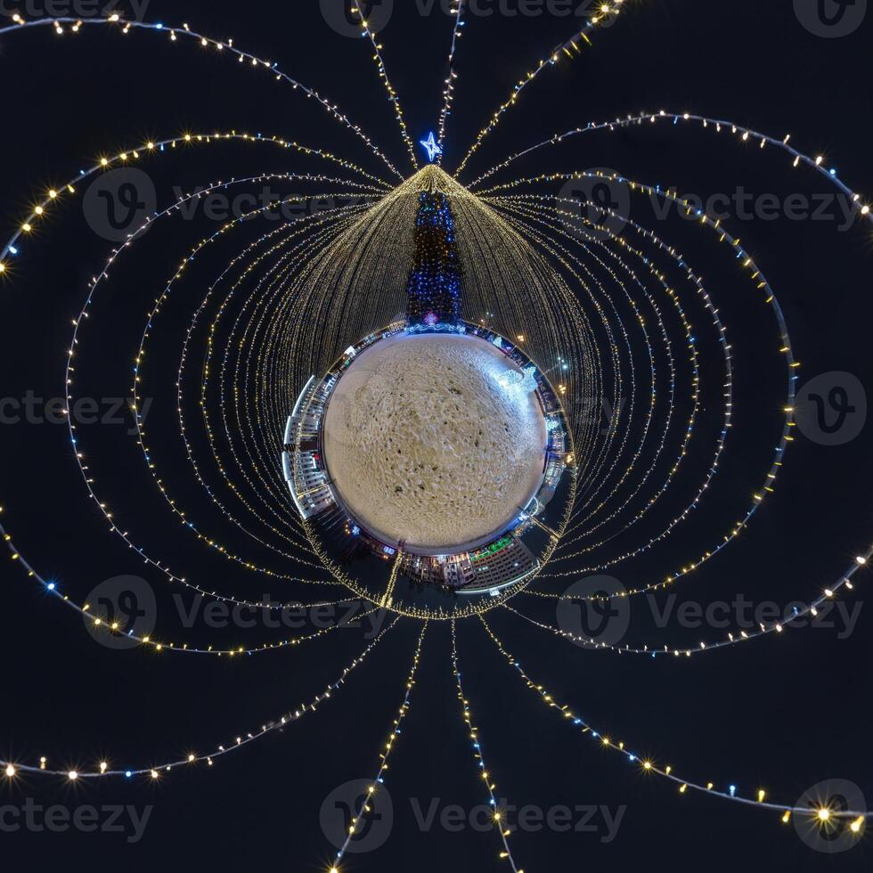 new year tiny planet with Christmas tree. Spherical aerial 360 panorama night view on festive square with illumination in form of tent photo