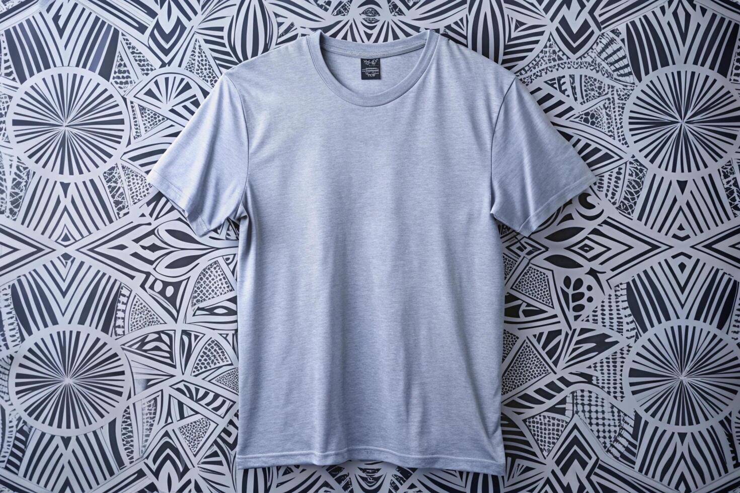 A t - shirt is sitting on a wall with a pattern photo