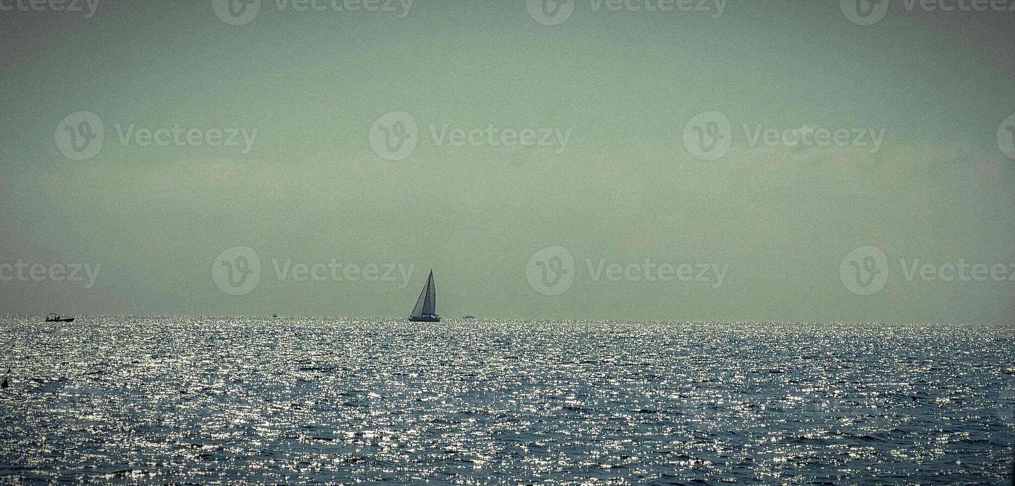 the expanse of blue sea off the coast of italy from a ferry travelling to palermo, sicily for the summer holidays of 2024 photo