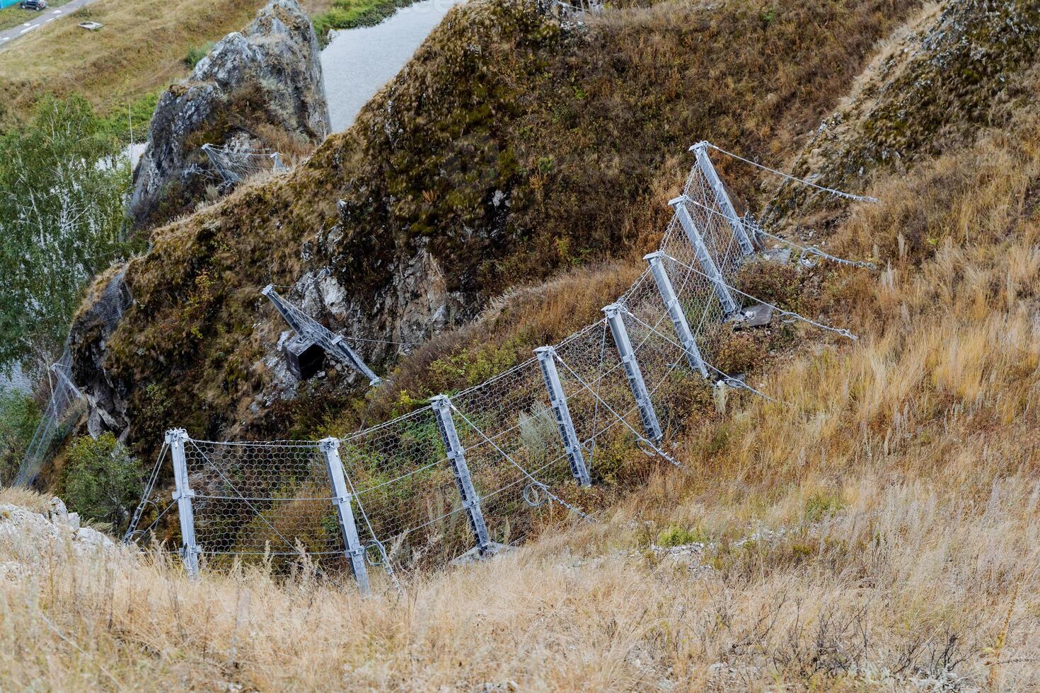 Dividing the boundaries of the territory, a live fence, a protective structure with an electric current. photo