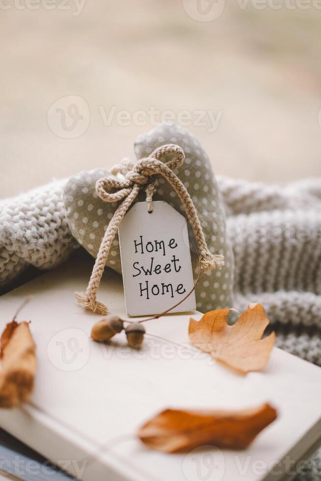Still life details in home. Cozy home decoration with a heart-shaped tag photo
